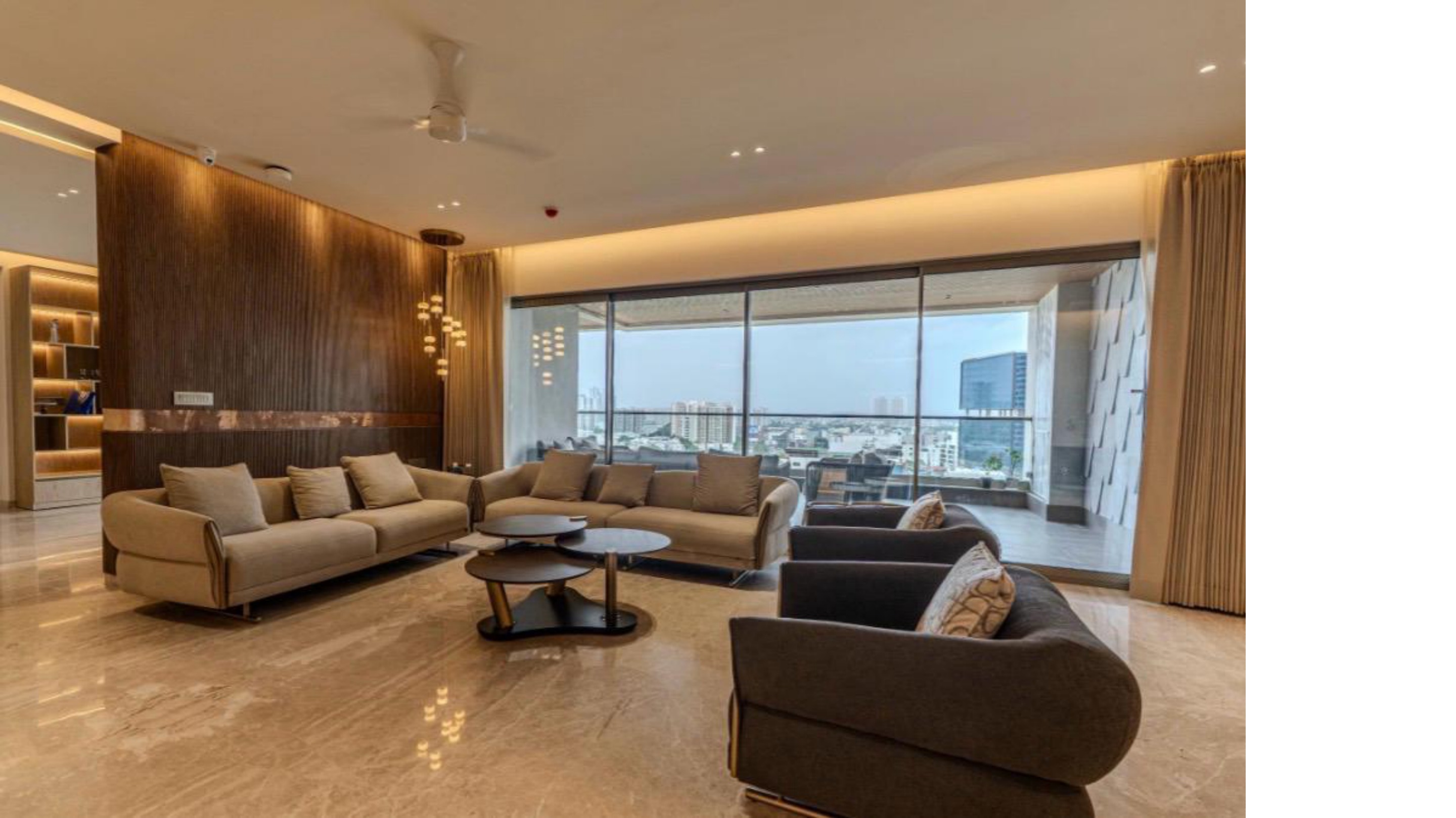 Soft Geometric — living area with warm wood feature wall and city-facing balcony